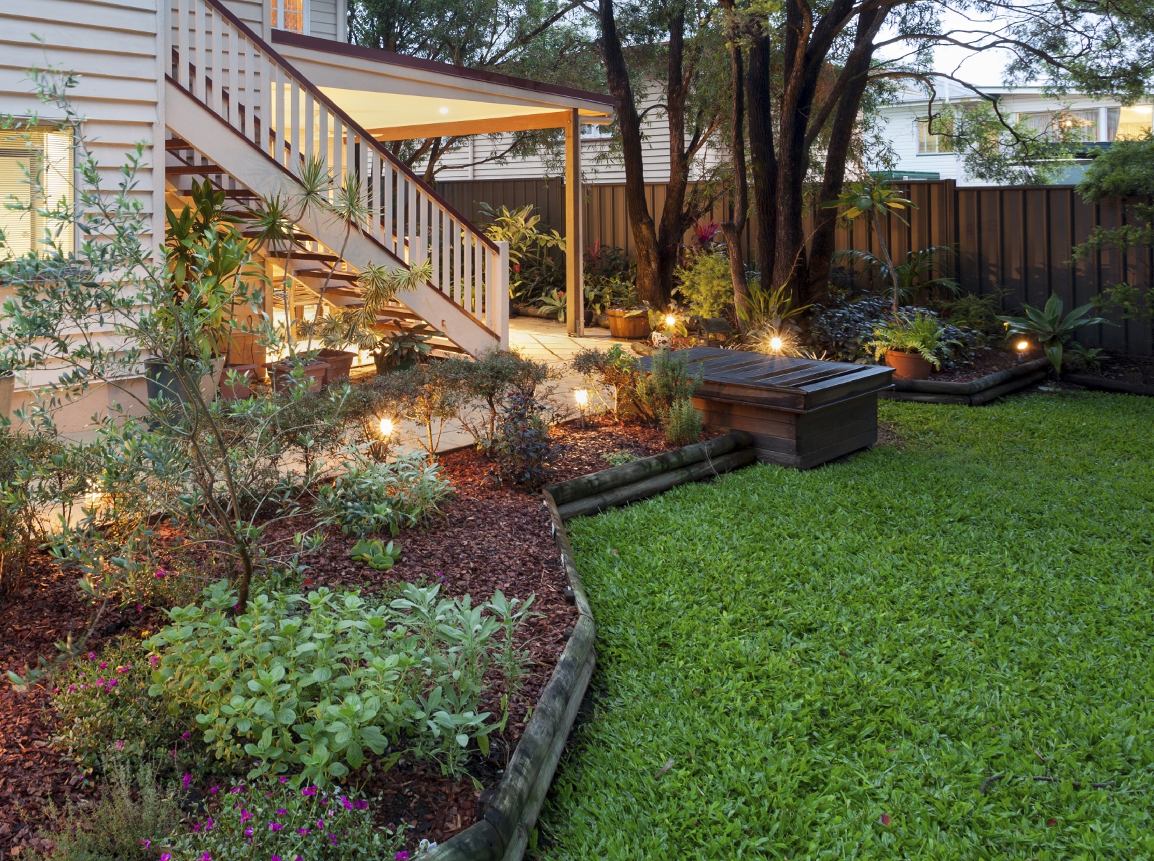 A large backyard with a well-manicured lawn